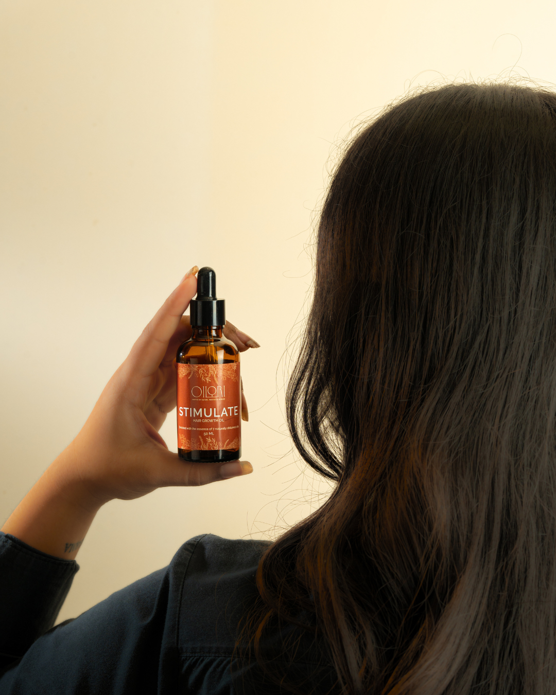 Natural hair growth oil blend formulated to nourish scalp and promote thicker, healthier hair.