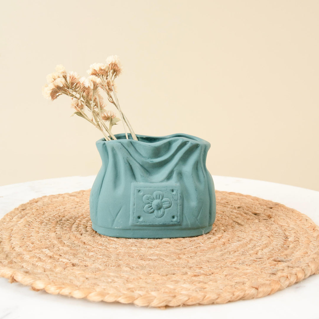 Emerald handbag - https://artecasa.in/