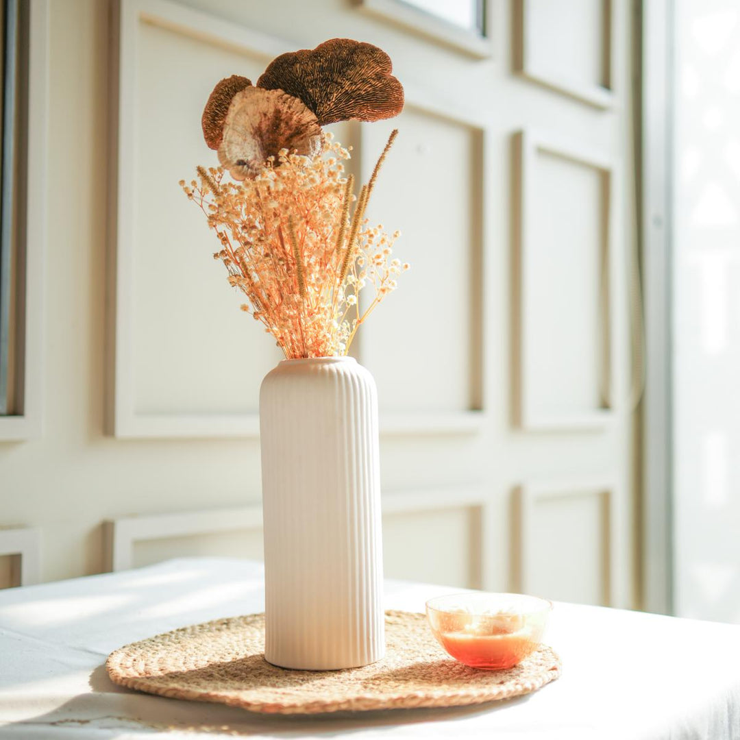 Golden harvest bunch with snow white vase