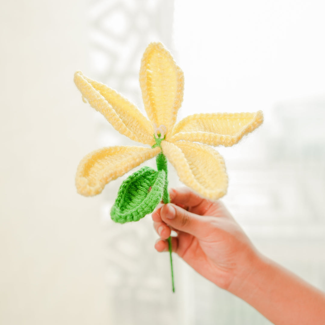 Stacked tiered pottery vase with crochet yellow Lily