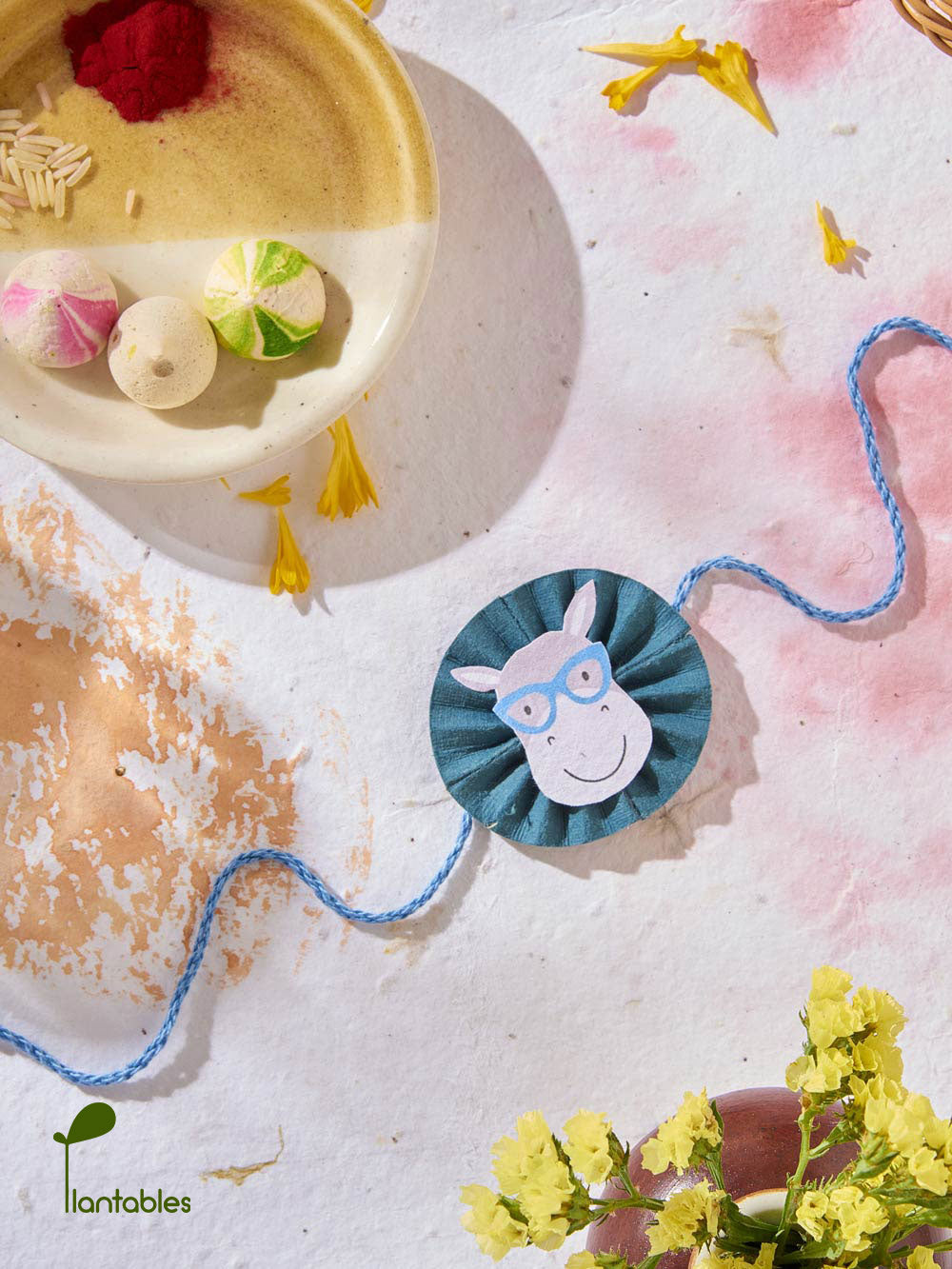 Plantables Cow with Cat-Eyed Spectacles Rakhi