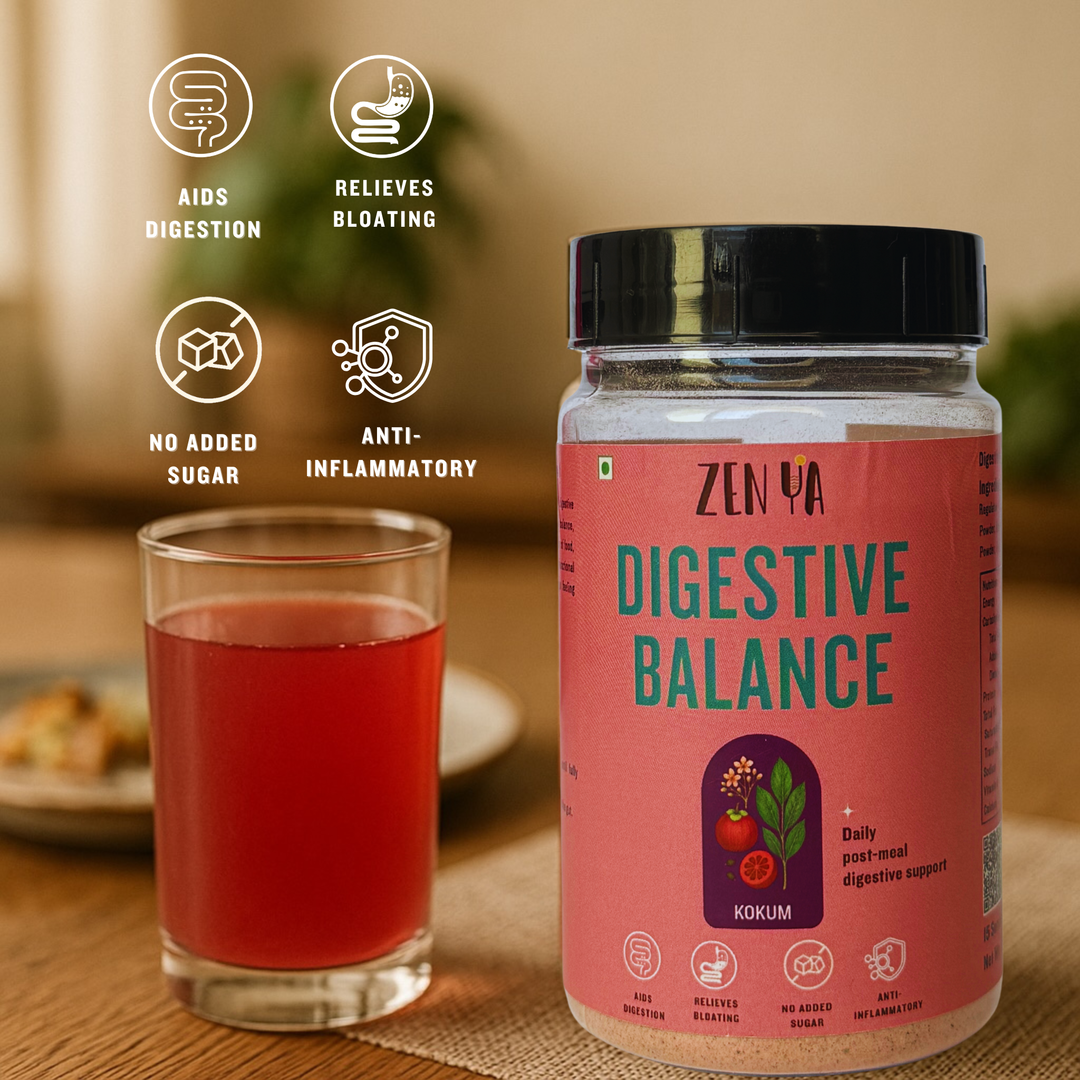 ZenYa Digestive Balance kokum drink mix jar placed on a wooden table beside a clear glass of deep pink kokum drink, styled in a warm, minimal home setting with soft natural light and a blurred background.