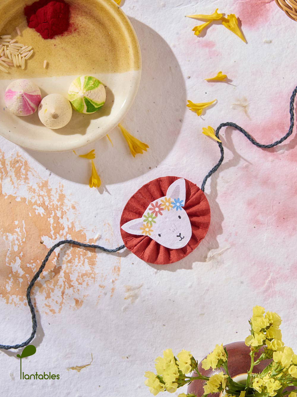 Plantables Lamb with a Floral Headgear Rakhi Planting Kit
