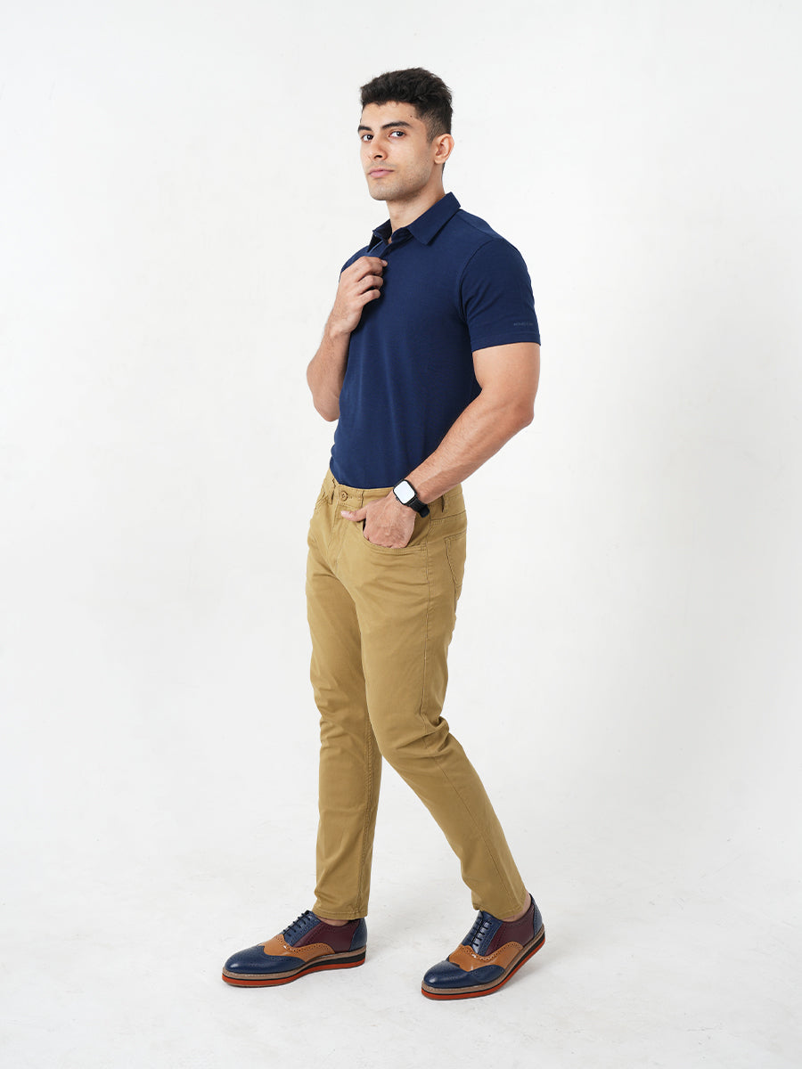 A man in a comfortable Monkstory Bamboo Cotton Polo Tee - Navy Blue posing for a photo.