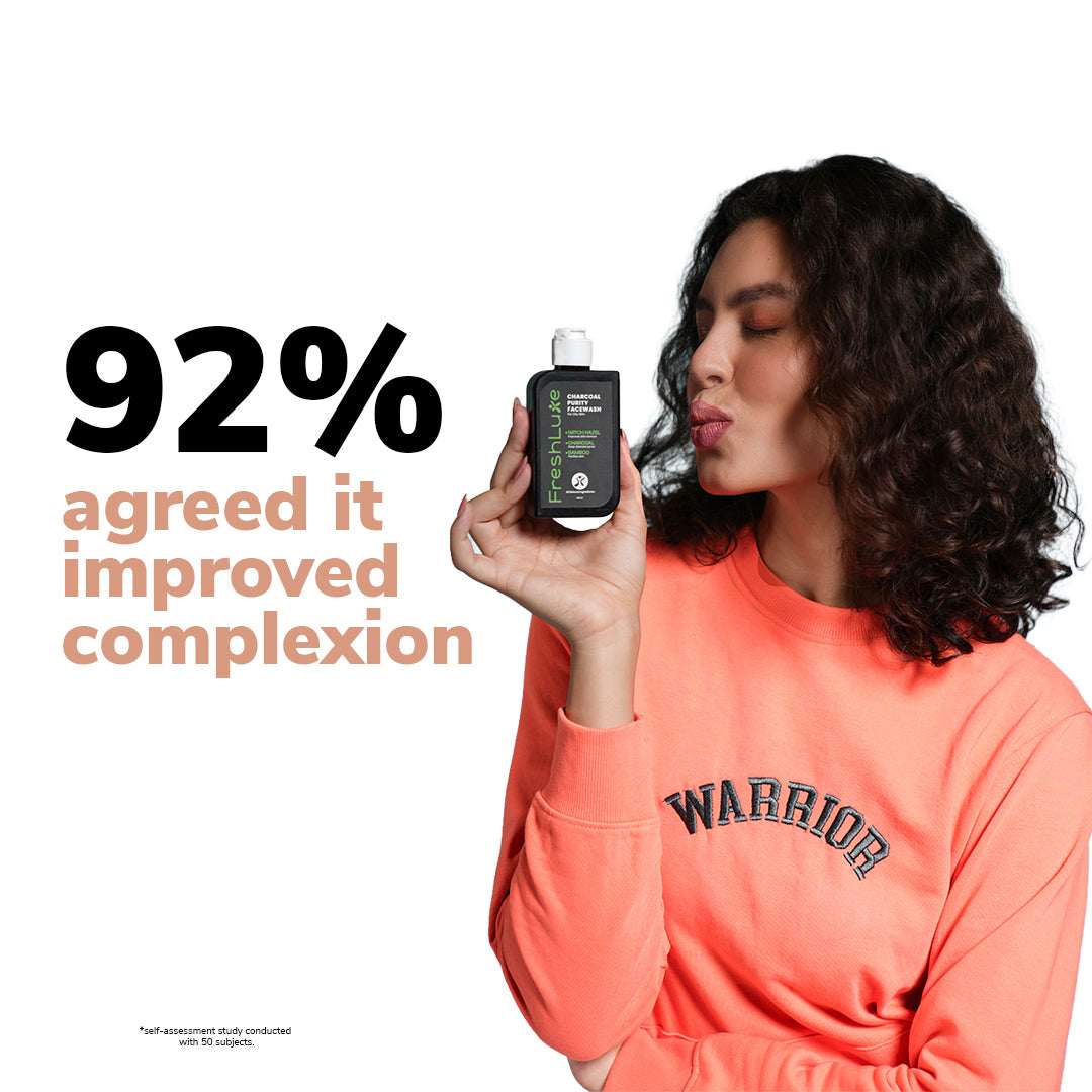 Woman holding a bottle of skincare product with text about improved complexion on a white background