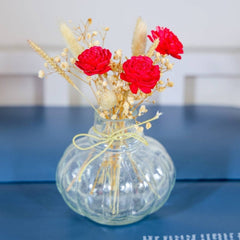Mini glass bottle vase with red velvet dried flower bunch