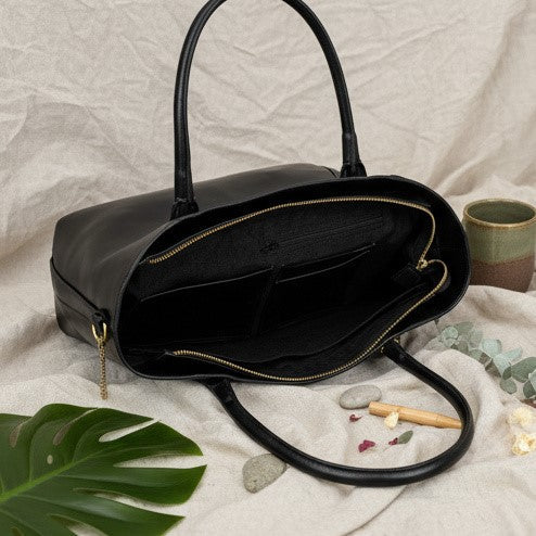 Athena black plant-based leather tote bag showing spacious interior compartments and organised storage design