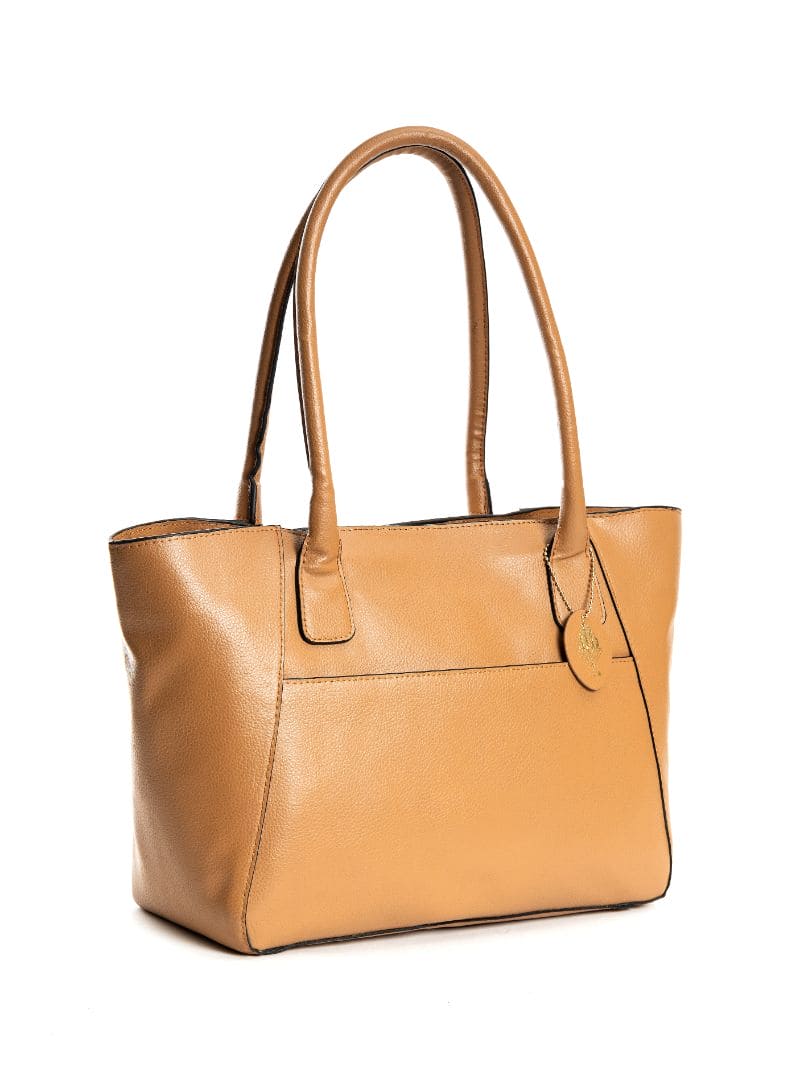 Athena caramel plant-based leather tote bag angled view showing structure, handles and clean silhouette
