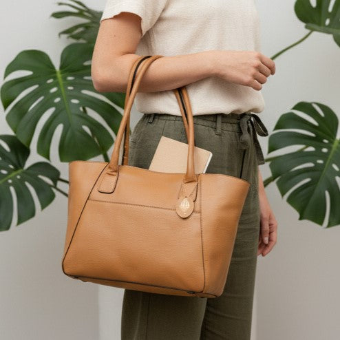 Athena caramel plant-based leather tote bag carried by model showing size, structure and everyday use