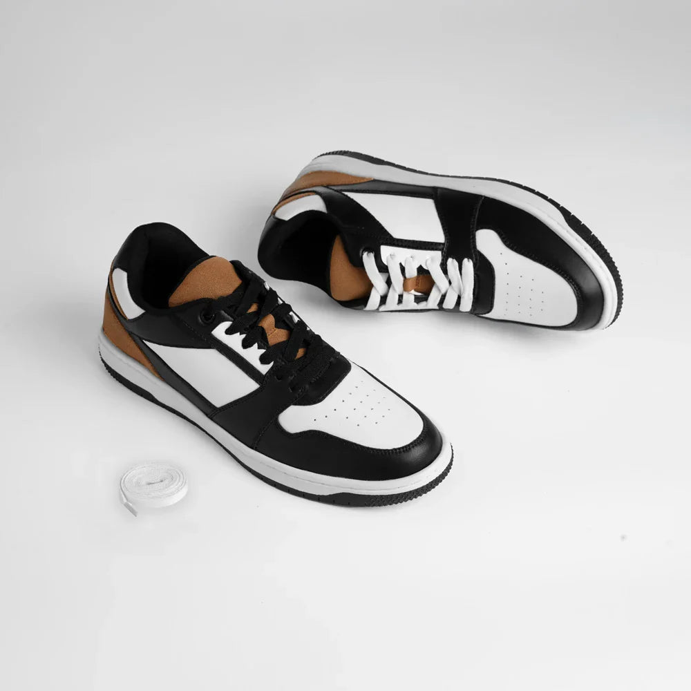 Black, white, and brown sneakers on a light gray background