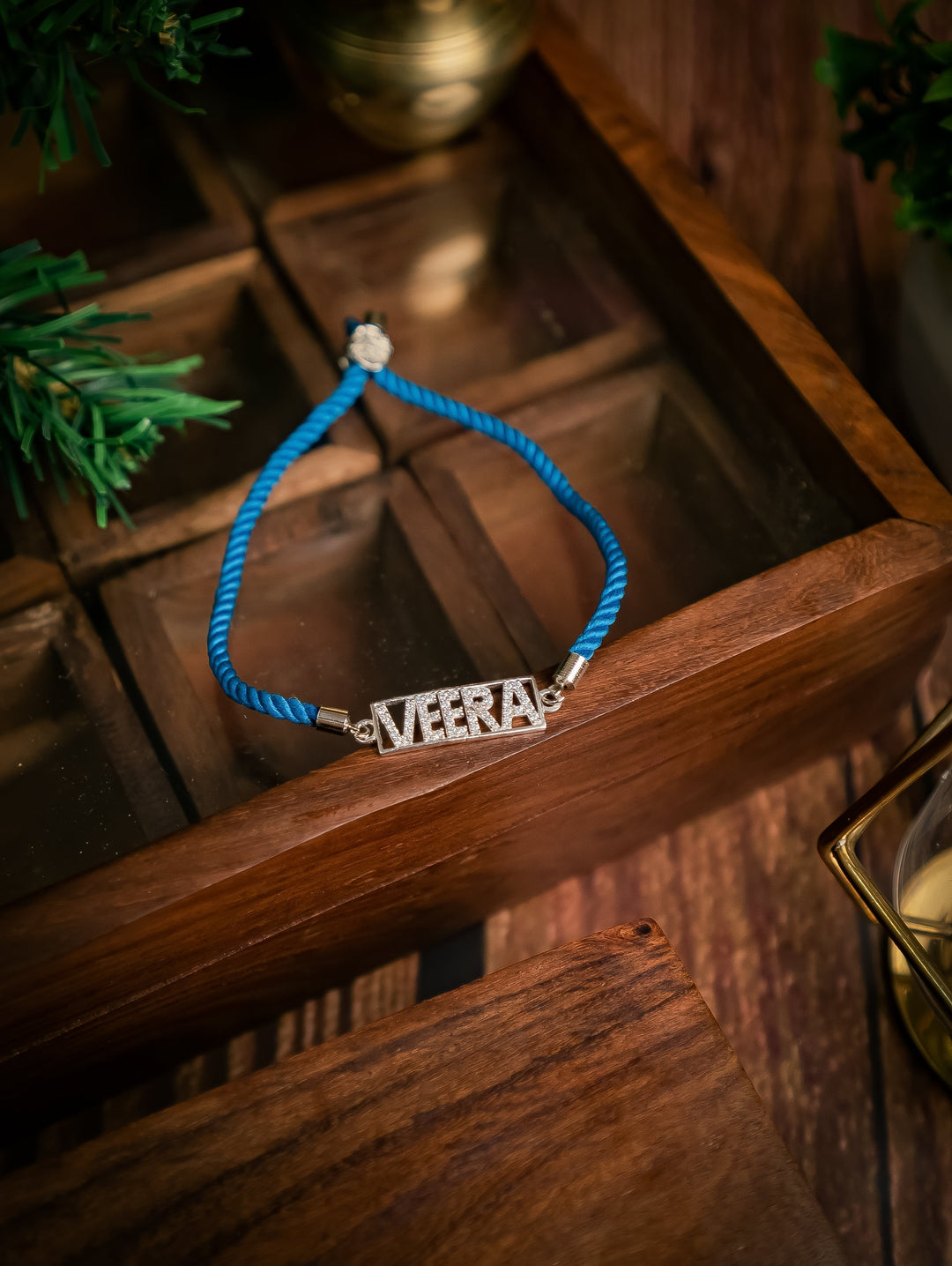 Diamond By Tilesh Silver Custom Name Rakhi – "VEERA"