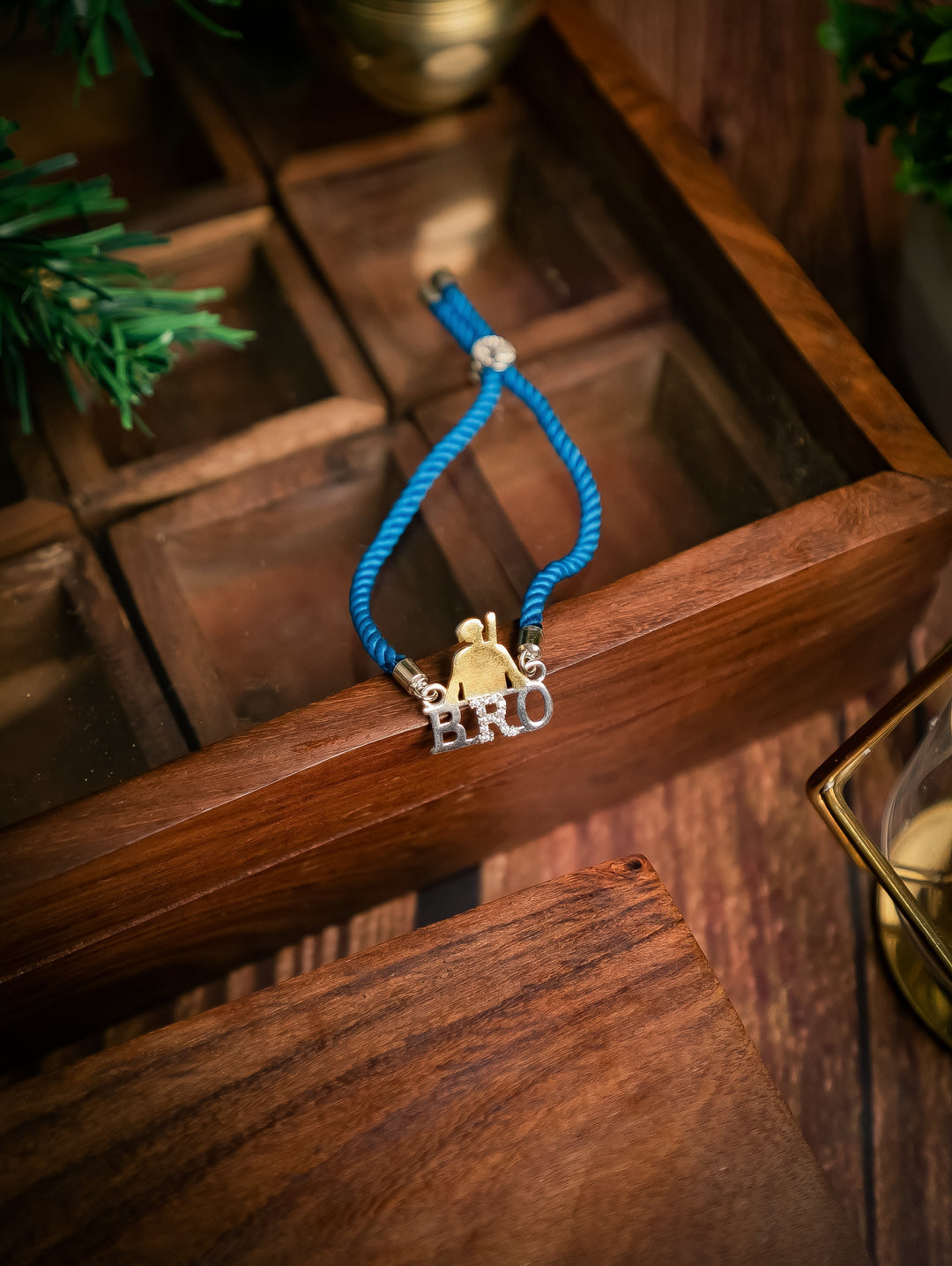 Diamond By Tilesh Sterling Silver Bro Rakhi – Cool Brother Emblem with Blue Thread