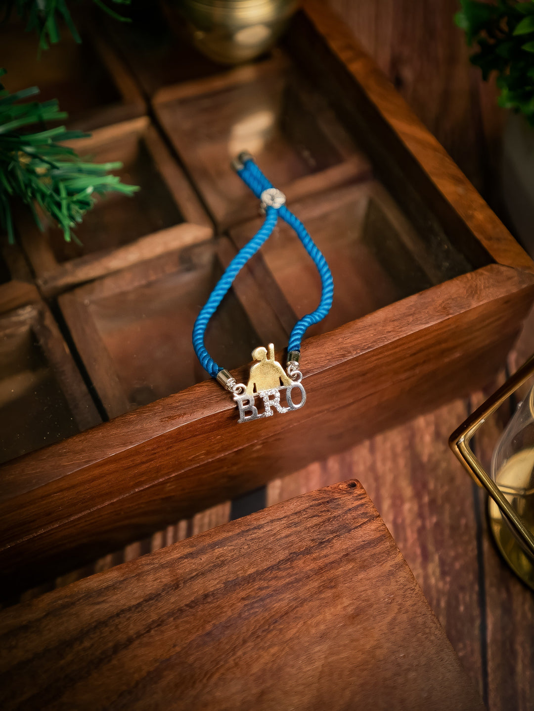 Diamond By Tilesh Sterling Silver Bro Rakhi – Cool Brother Emblem with Blue Thread