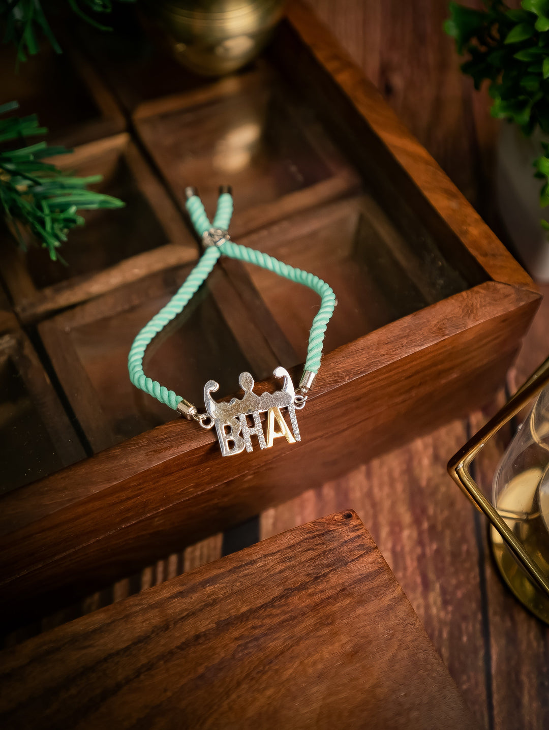 Diamond By Tilesh Sterling Silver Bhai Rakhi – Playful Brother Bond Design with Aqua Thread