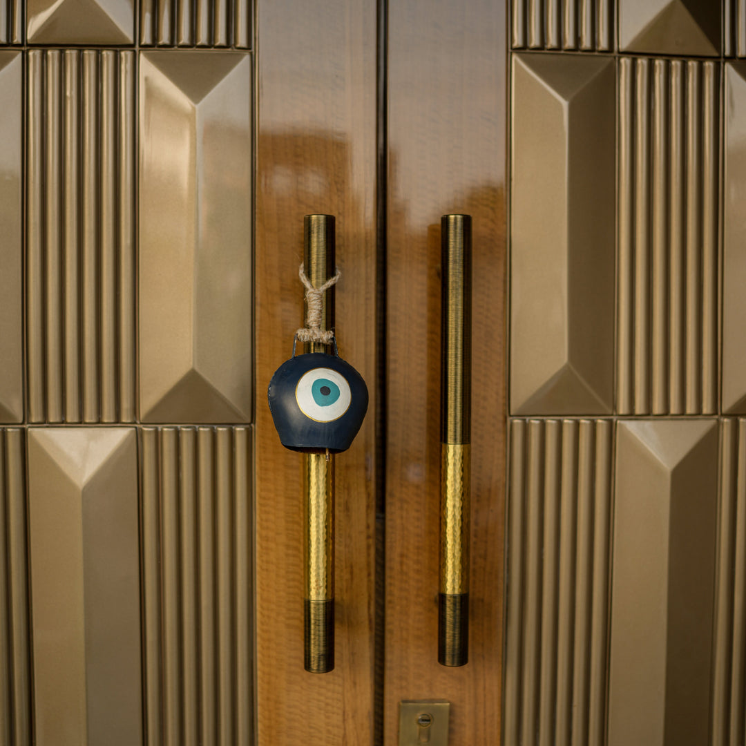 Evil Eye Cowbell Hanging | Handcrafted and Sustainable | Protective Wall & Door Hanging with Soothing Sound - Suspire