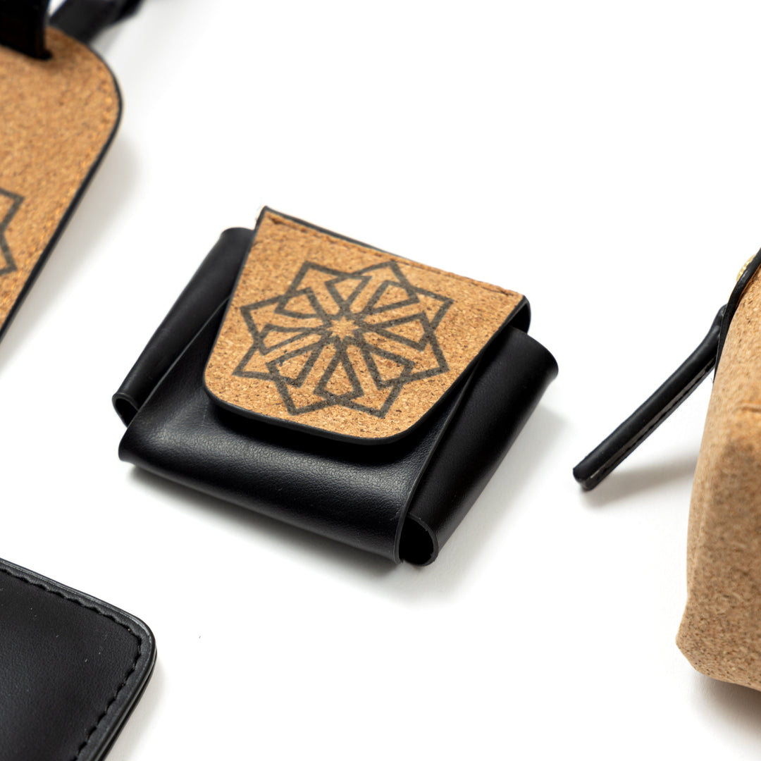 Plant leather AirPods cover from the Noir Holiday Travel Set by Green Hermitage with cork flap design