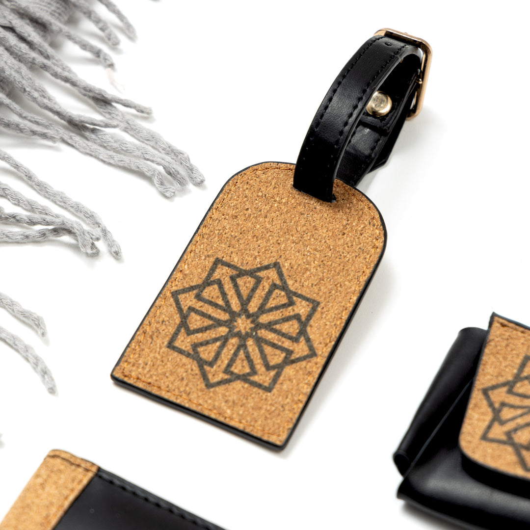 Plant leather travel luggage tag from the Noir Holiday Travel Set by Green Hermitage with cork design and adjustable strap