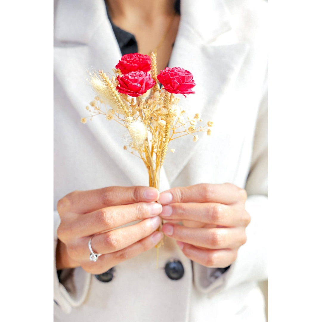 Mini glass bottle vase with red velvet dried flower bunch