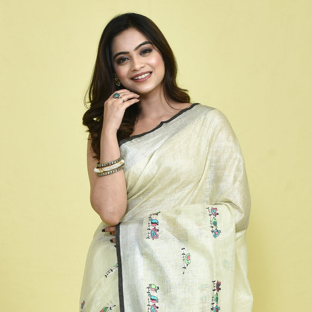 Stotra Cream Pure Linen Saree with Bird Embroidery and Silver Zari Border