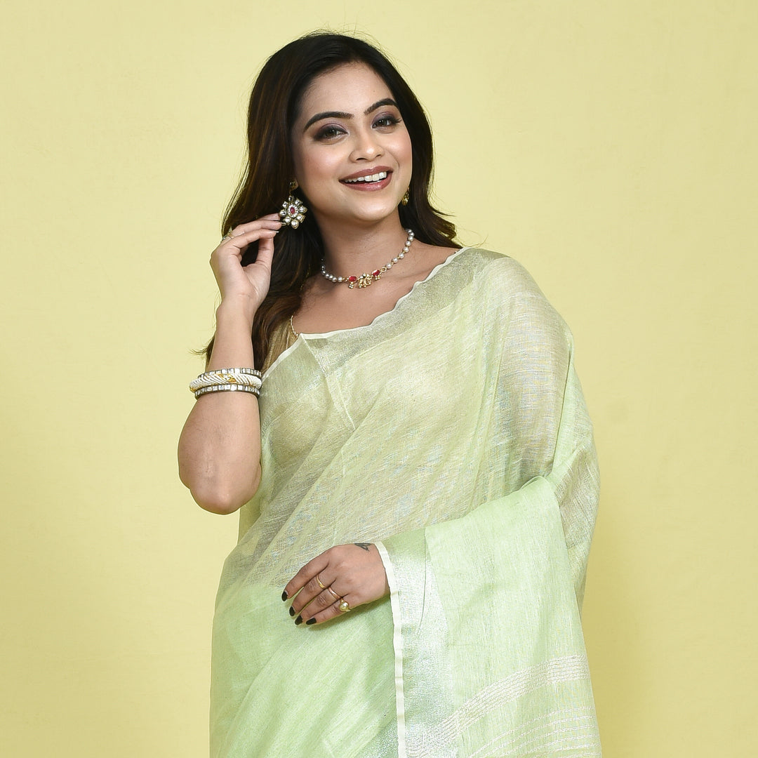 Stotra Light Green Pure Linen Saree with Silver Zari Border