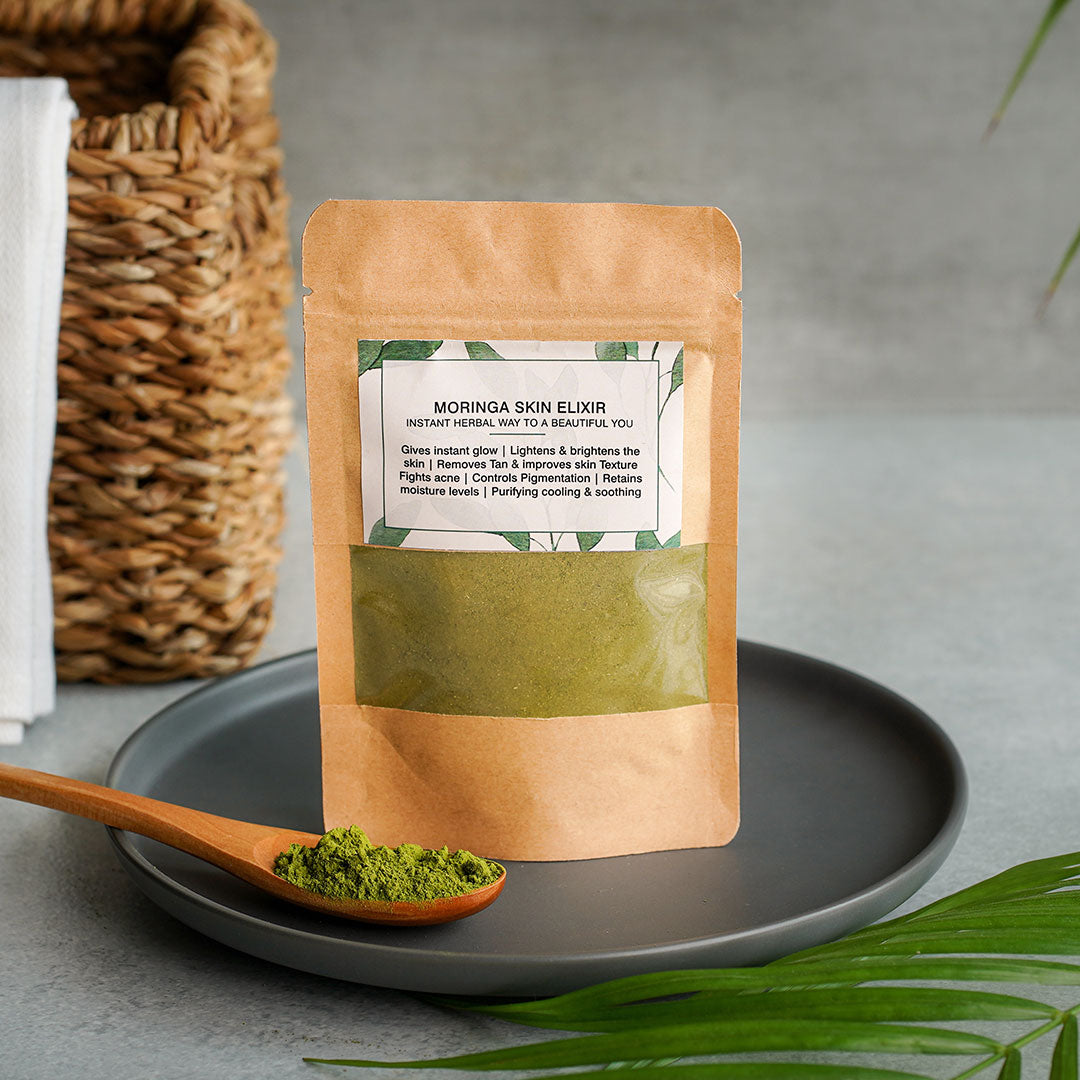Moringa Skin Elixir powder in eco-friendly packaging with herbal ingredients