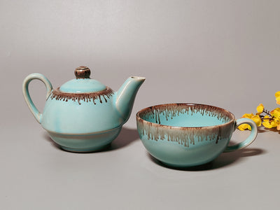 Ceramic handcrafted light blue and golden kettle and cup set