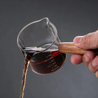 The Bean Co Roasters 75ml Measuring Glass with Wooden Handle – Heat-Resistant Borosilicate Glass | For Espresso, Coffee, and Kitchen Use