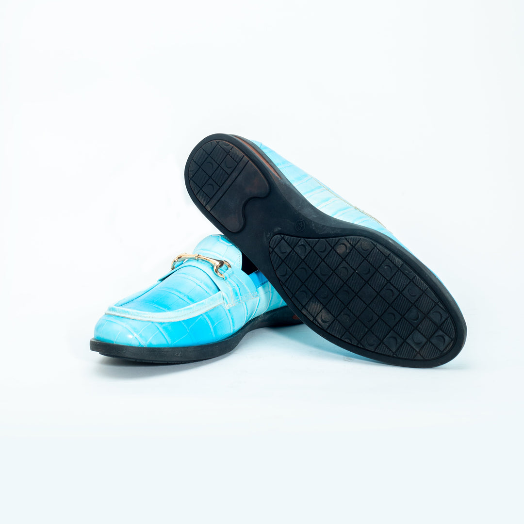A pair of vibrant Monkstory brand Flatform Horsebit Slip Ons in powder blue crocodile skin, perfect for formal occasions.