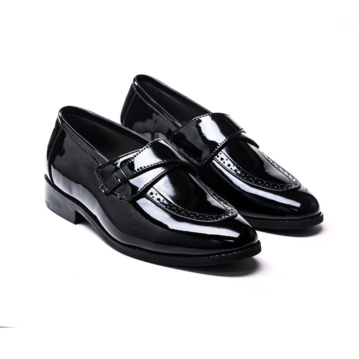 A pair of Drezzire Classic Patent Slip-Ons - Black from monkstory on a white background.